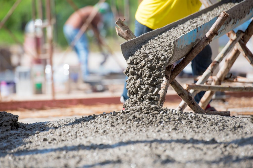 Concrete pouring during commercial concreting floors of building betonáž základov